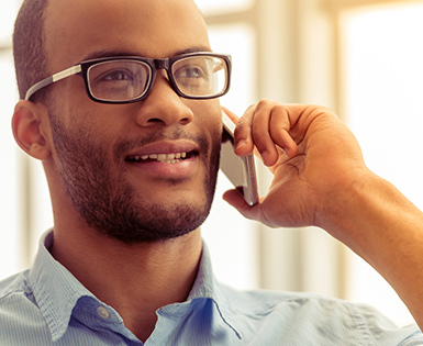 Man speaking onto his mobile device 