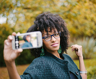 Woman Taking Selfie with Smartphone